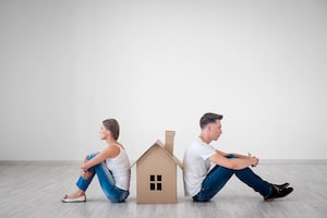 Couple with a Cardboard House